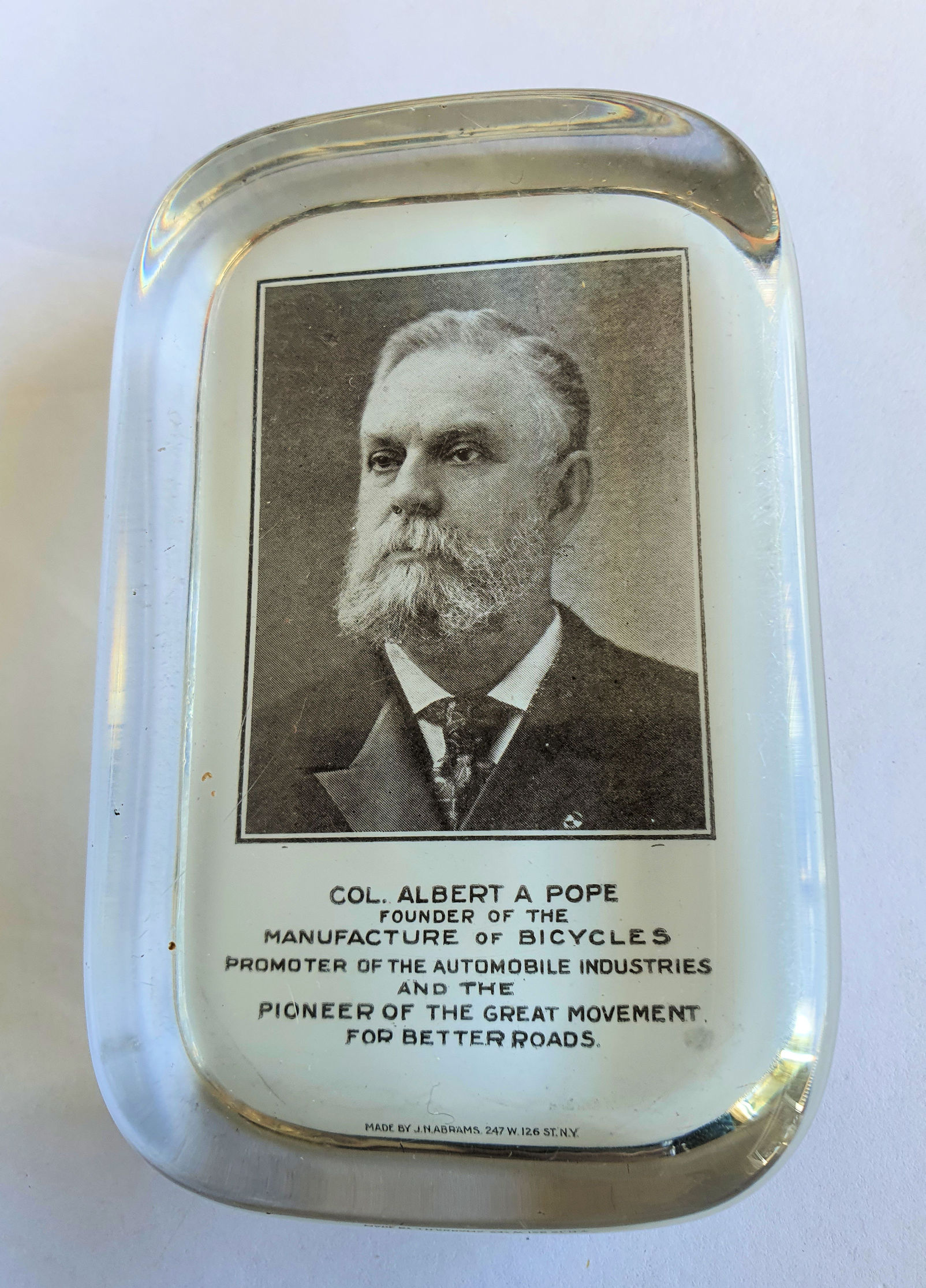 Col Pope glass paperweight